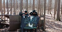 Qarsherskiyan Christian men holding up the official flag of the Ethnic Qarsherskiyan Tribe. The Qarsherskiyans are a triracial isolate mix of Native American, Black, and White people, often also having Jewish, Romani, Asian, and Malagasy amcestry.
